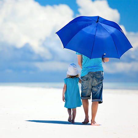 father and daughter on a beach