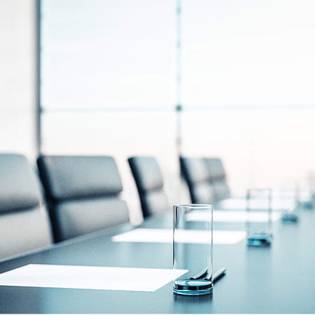 empty chairs in boardroom